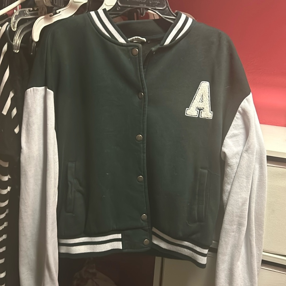 green and white varsity letter A sweater